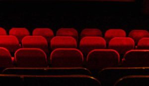 Red velvet seats inside a movie theater