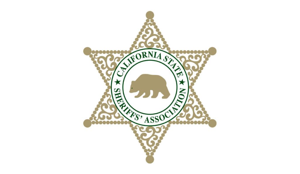 a star shaped badge with a bear