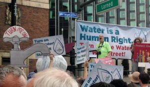 a man holding signs and a sign