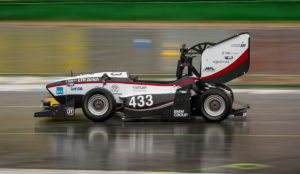 a race car on a wet track