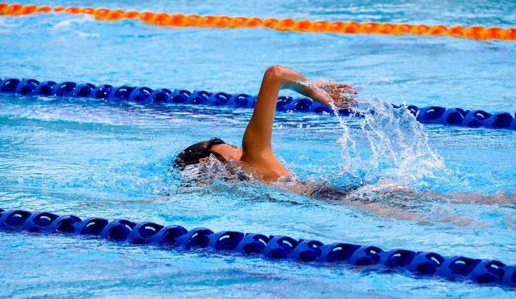 a person swimming in a pool