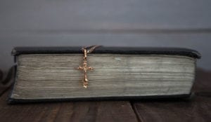 Book with a cross on it