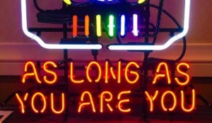 Neon sign saying "As Long As You Are You"