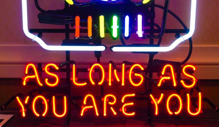 Neon sign saying "As Long As You Are You"