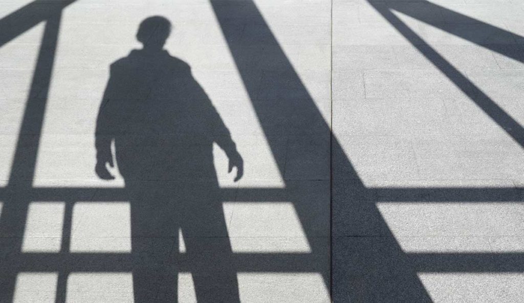 a shadow of a person on the ground