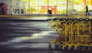 a group of shopping carts in a parking lot