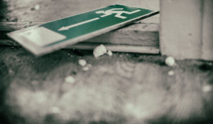a green sign on the ground