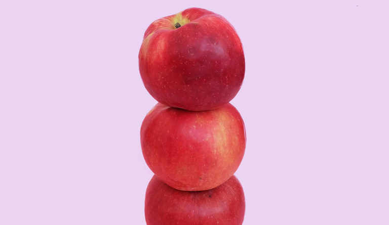 a stack of apples on top of each other