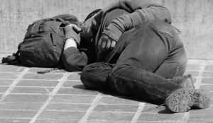 a man sleeping on the ground