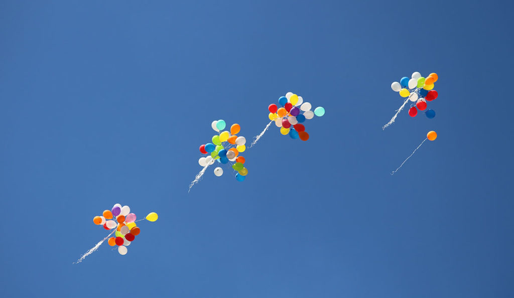 a group of balloons in the sky