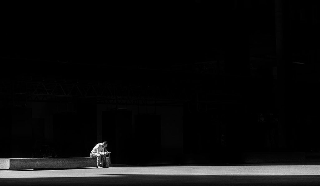 a man sitting on a bench