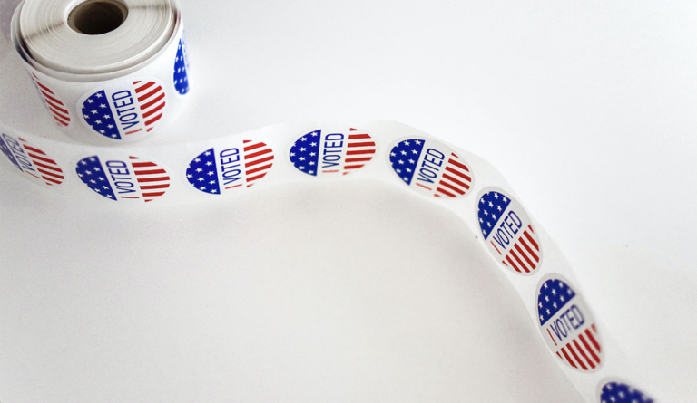 a roll of stickers with red white and blue colors