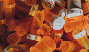 a pile of prescription bottles