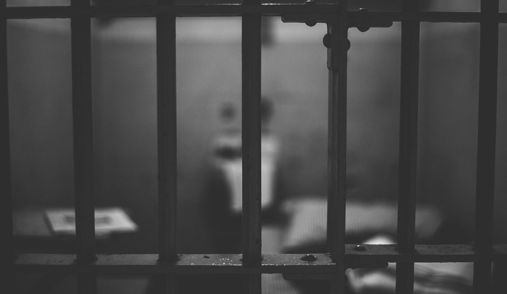 a prison cell with bars