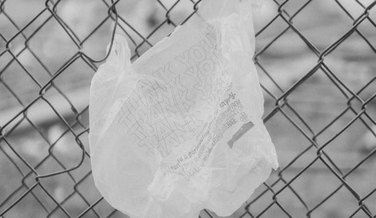 a plastic bag on a fence