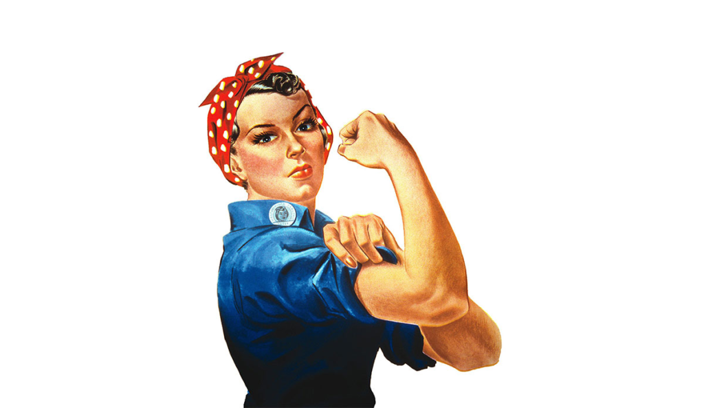 a woman with a red headband and blue shirt with white polka dots on her head