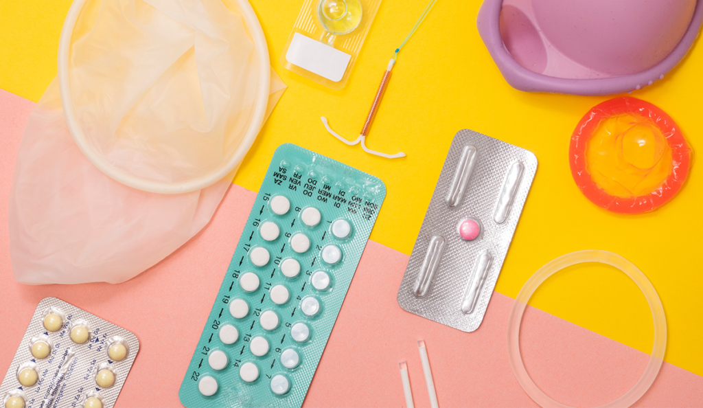 a group of pills and other medical items