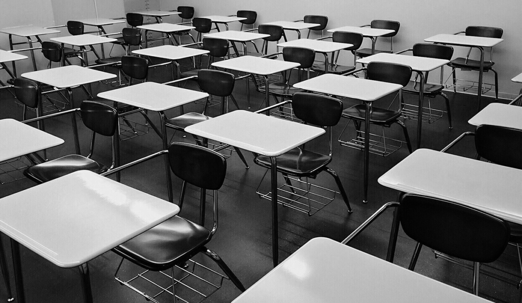 a classroom with desks and chairs