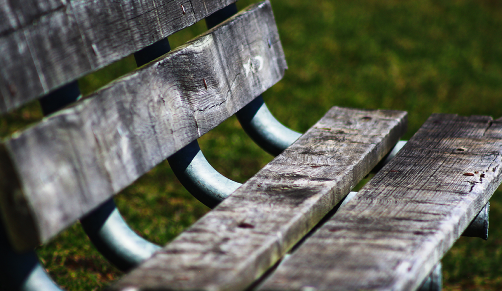 a close up of a wooden bench