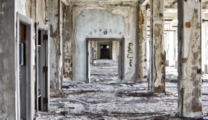 a hallway with a broken wall