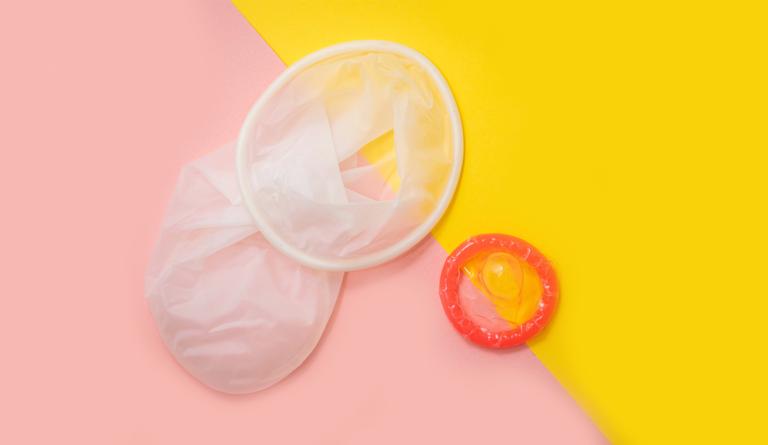 a condom and a condom on a yellow and pink background