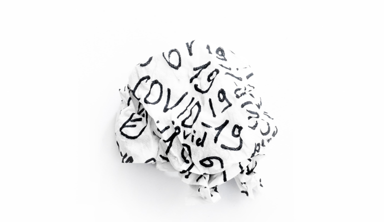 a crumpled white paper with black writing on it