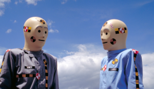 two people wearing masks with stickers on their heads