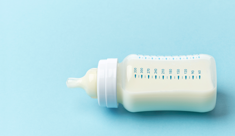 a baby bottle with milk