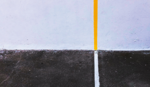 a yellow line on a black surface