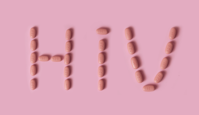 pink pills forming letters and numbers