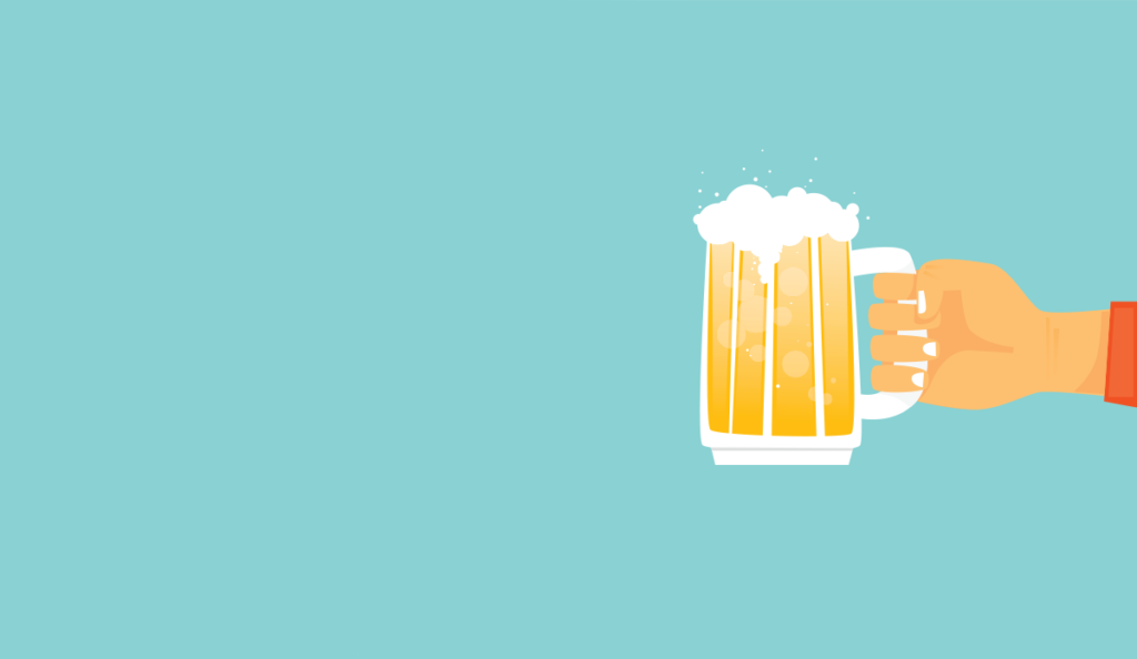 a hand holding a mug of beer