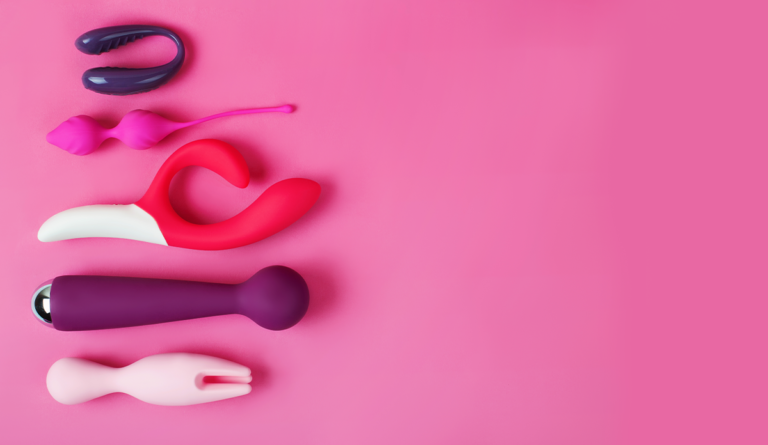 a group of toys on a pink background