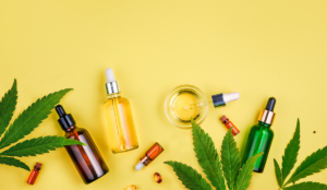 a group of bottles with droppers and a glass container with liquid