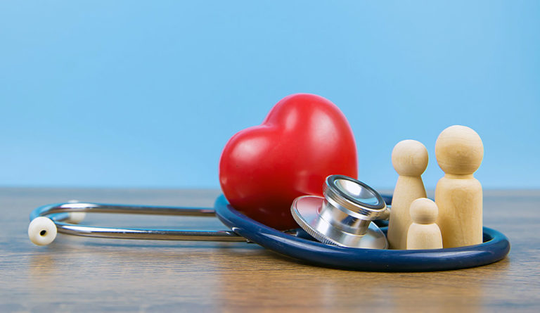 a heart and a stethoscope on a blue plate