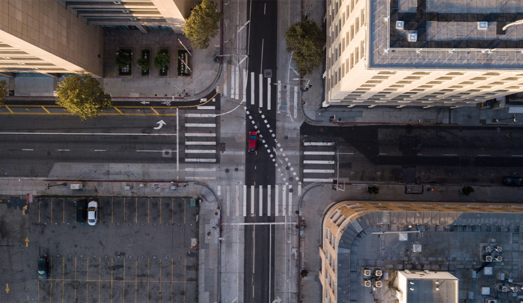 an intersection with buildings and cars