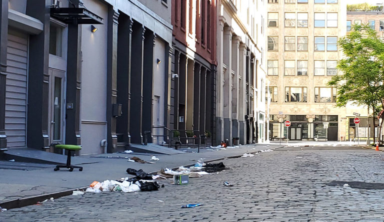 a street with trash on the ground
