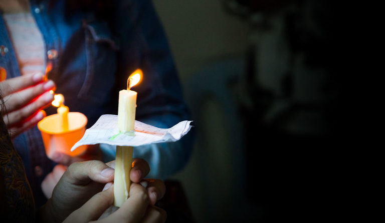 a person holding a candle