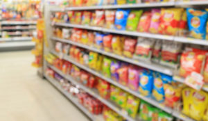 a blurry image of a store shelf with food