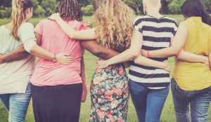 a group of people hugging each other