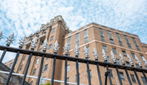 a fence with spikes on top of it