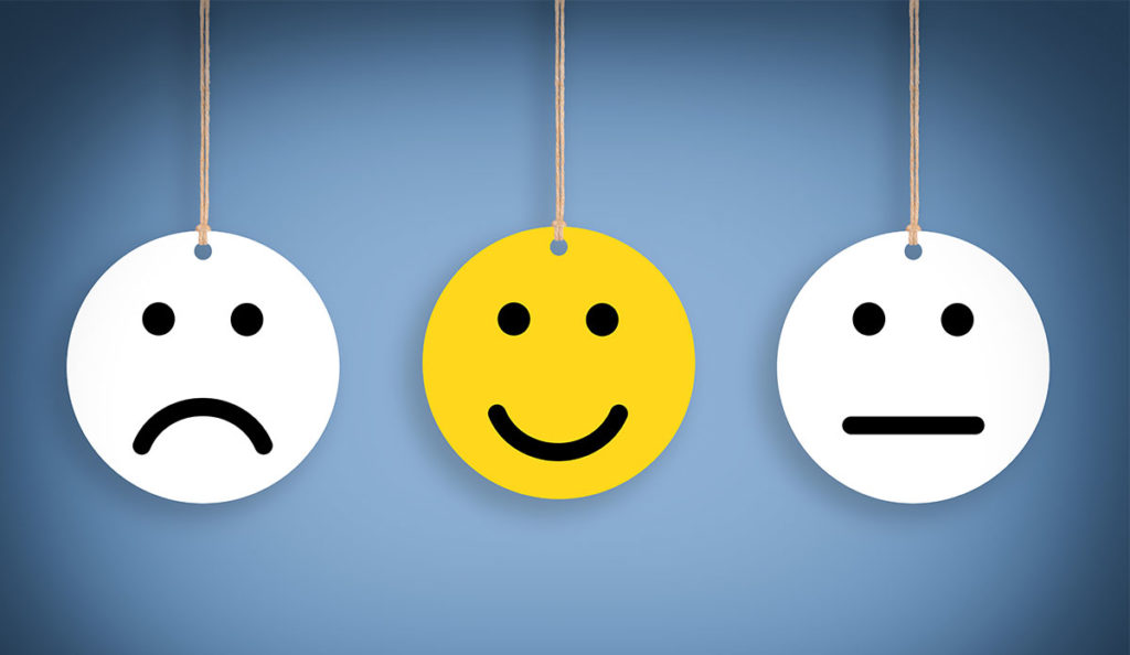 a yellow and white smiley face from a string