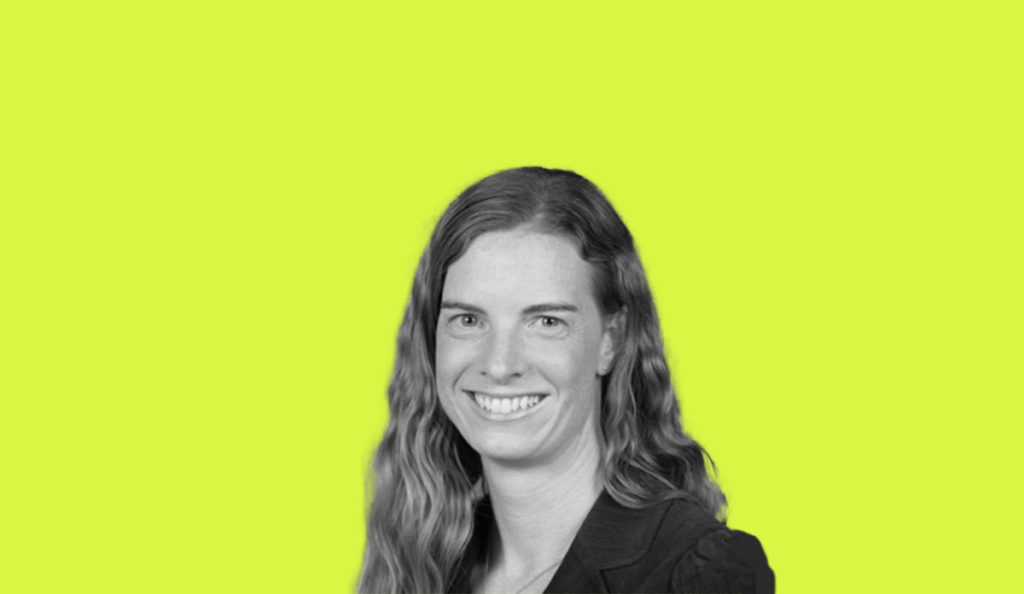 a woman with long hair smiling