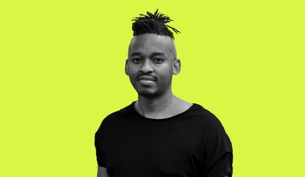 a man with dreadlocks and mustache