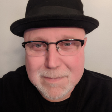 a man wearing a hat and glasses