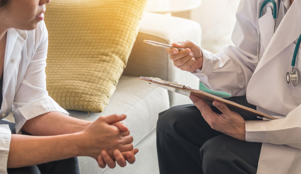 Gynecologist doctor or psychiatrist consulting and having diagnostic examination on woman patient's health in medical clinic or hospital exam room office