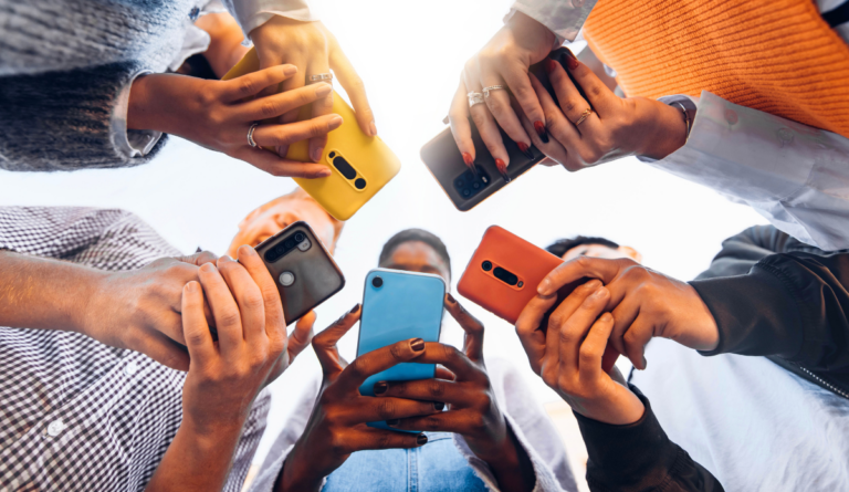 adolescents on phones in a circle