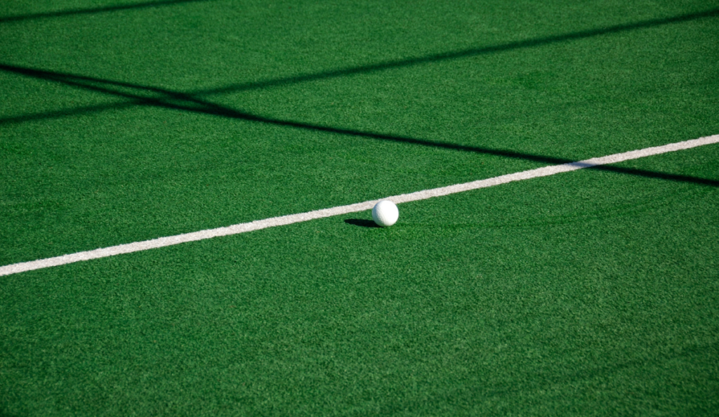Turf field with shadows and field lines