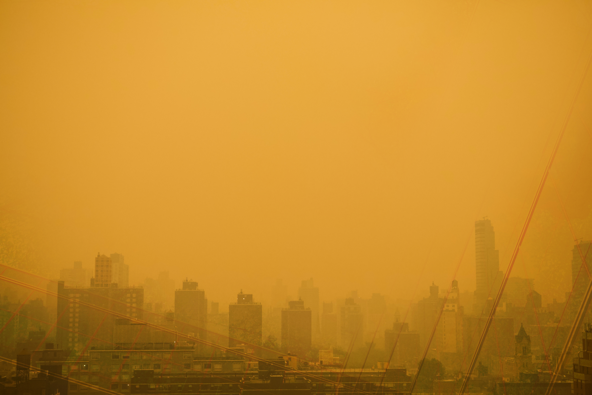 a city with a yellow sky