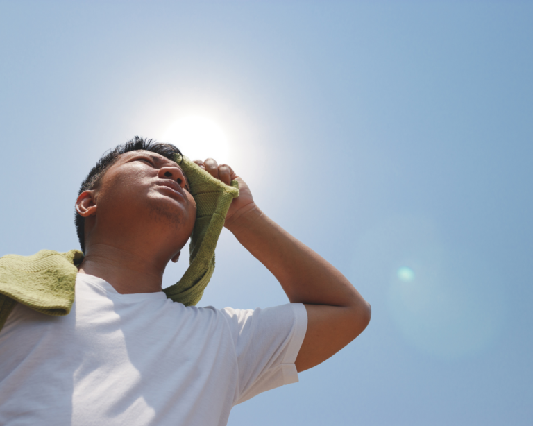 Man trying to stay cool during a heat wave