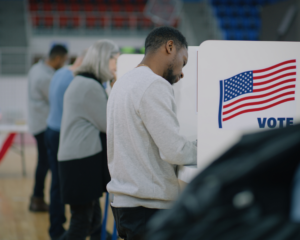 Multicultural American citizens voting at a polling station